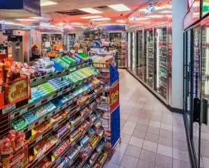 An interior view of a Convenience store, with gum and candy in view